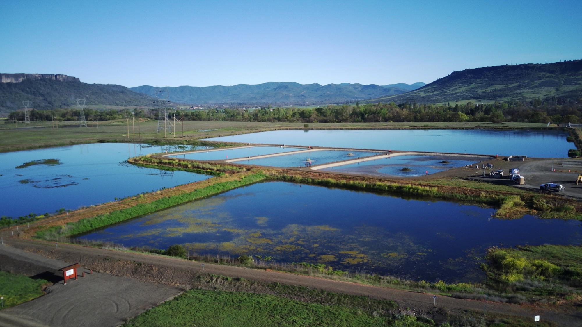 Sewage ponds with mountains in background